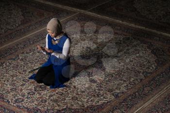 Young Muslim Woman Is Praying In The Mosque