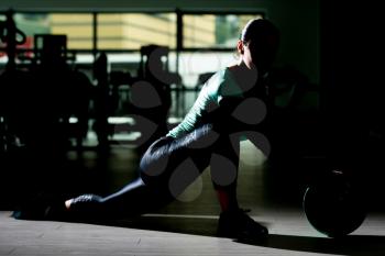 Siluet Attractive Woman Doing Stretching With Medicine Ball As Part Of Bodybuilding Training