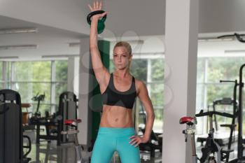 Fitness Woman Working With Kettle Bell In A Gym - Kettle-bell Exercise