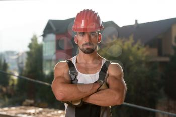 Successful Male Architect At A Building Site With Arms Crossed