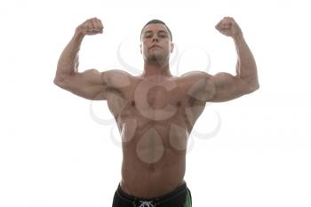 Muscular Young Man Posing In Studio - Isolated On White Background