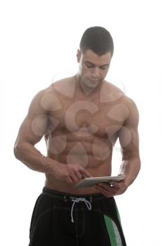 Portrait Of A Personal Trainer With Clipboards In His Hands Over White Background