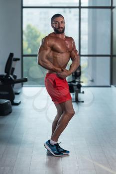 Portrait Of A Young Physically Fit Man Showing His Well Trained Body - Muscular Latin Athletic Bodybuilder Fitness Model Posing After Exercises