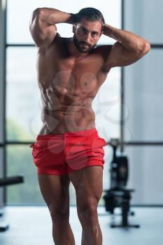 Portrait Of A Young Physically Fit Man Showing His Well Trained Body - Muscular Latin Athletic Bodybuilder Fitness Model Posing After Exercises
