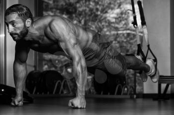 Italian Adult Athlete Doing Push Ups As Part Of Bodybuilding Training With Trx Fitness Straps