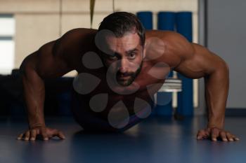 Latin Adult Athlete Doing Push Ups As Part Of Bodybuilding Training With Trx Fitness Straps