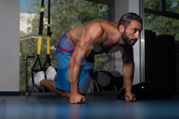 Latin Adult Athlete Doing Push Ups As Part Of Bodybuilding Training With Trx Fitness Straps