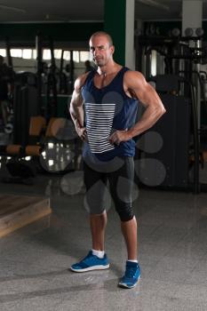 Portrait Of A Physically Fit Man Showing His Well Trained Body - Muscular Athletic Bodybuilder Fitness Model Posing After Exercises