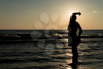 Sexy Girl Silhouette On The Beach At Sunset Over The Sea - Copy Space Text