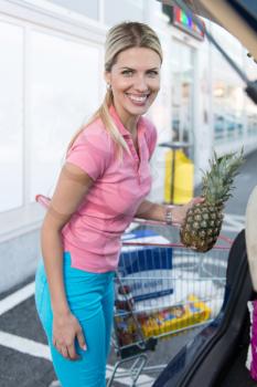 Customer Woman Loading Car With Food at Supermarket Car Park