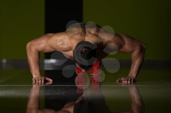 Healthy Adult Athlete Doing Push Ups As Part Of Bodybuilding Training