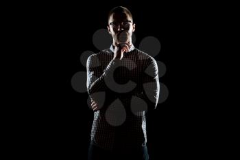 Silhouette Portrait Of A Young Physically Fit Man in Shirt Posing