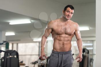 Portrait Of A Young Physically Fit Hairy Man Showing His Well Trained Body - Muscular Athletic Bodybuilder Fitness Model Posing After Exercises