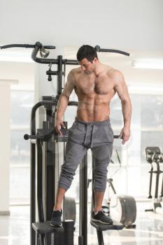 Hairy Handsome Young Man Standing Strong In The Gym And Flexing Muscles - Muscular Athletic Bodybuilder Fitness Model Posing After Exercises