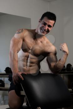 Muscular Man Resting After Exercises - Portrait Of A Physically Fit Young Man Without A Shirt
