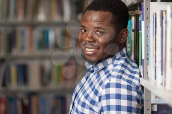 Portrait Of A College Student Man In Library - Shallow Depth Of Field