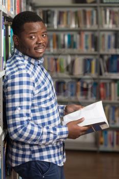 Portrait Of A College Student Man In Library - Shallow Depth Of Field