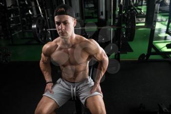 Muscular Man Resting After Exercises - Portrait Of A Physically Fit Young Man In Gym