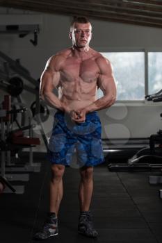 Portrait Of A Physically Fit Man Showing His Well Trained Body - Muscular Athletic Bodybuilder Fitness Model Posing After Exercises