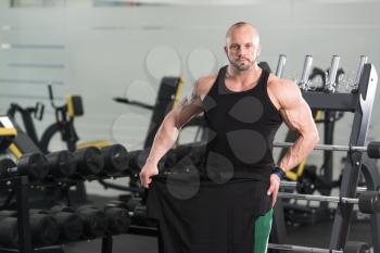 Muscular Handsome Bodybuilder With T-shirt For Copy Space