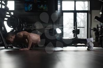 Young Man Athlete Doing Pushups As Part Of Bodybuilding Training