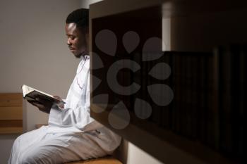 Black African Muslim Man Reading Holy Islamic Book Koran