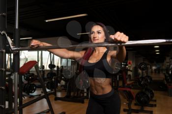 Healthy Fitness Woman Preparing To Working Out Legs With Barbell In A Gym - Squat Exercise