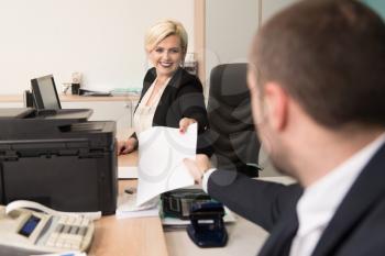 Happy Young Business Man And Woman Work In Modern Office On Computer