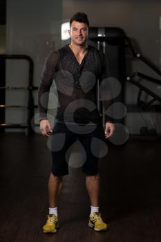 Portrait of a Young Physically Fit Man in Black T-shirt Long Sleevs Showing His Well Trained Body - Muscular Athletic Bodybuilder Fitness Model Posing After Exercises