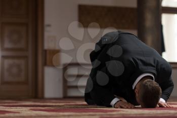 Businessman Muslim Making Traditional Prayer to God Allah in the Mosque