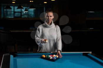 Portrait Of A Young Girl Playing Billiards