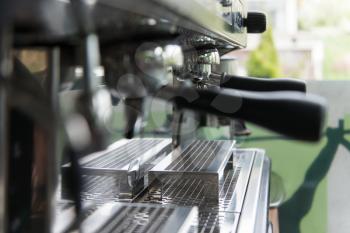 Close-up of Professional Coffee Machine Making Espresso in a Cafe