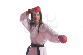 Young Muslim Woman In Traditional Kimono Practicing Her Karate Moves - Isolated On White Background