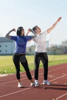 Portrait Of A Sexy Couplein in City Park Area - Training and Exercising for Endurance - Healthy Lifestyle Concept Outdoor