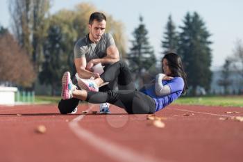Young Couple Exercising in City Park Area - Training and Exercising for Endurance - Fitness Healthy Lifestyle Concept Outdoor