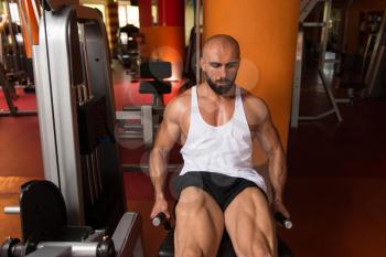 Man Doing Leg With Machine In Gym - Leg Exercises