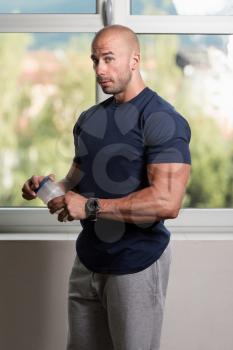 Muscular Handsome Bodybuilder With Pills And Dope For Copy Space