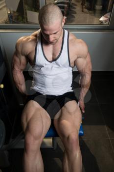 Leg Exercises Close Up -  Man Doing Leg With Machine In Gym