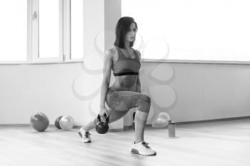 Woman Working With Kettle Bell In A Gym - Kettle-bell Exercise