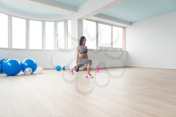 Fitness Woman Working With Kettle Bell In A Gym - Kettle-bell Exercise