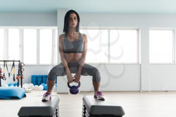 Woman Working With Kettle Bell In A Gym - Kettle-bell Exercise