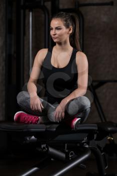 Pretty Good Looking And Attractive Young Woman With Muscular Body Relaxing Or Resting In Gym