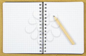 Royalty Free Photo of a Pencil and Notebook