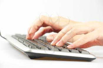 Close-up of hand touching computer keys