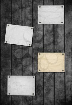 Note paper and paper clip on wooden background