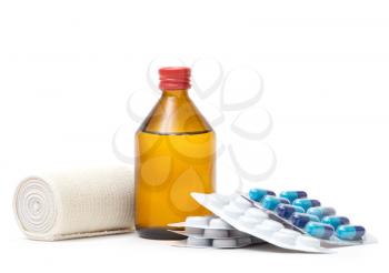 Medical bottles with  tablets isolated on white