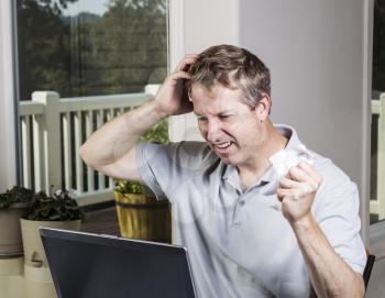 Man showing frustration with data results for work at home