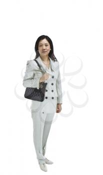 Asian woman dressed in business formal white outfit with black purse over shoulder on white background