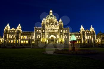 Capital building of Victoria Canada at night time with blue sky in background