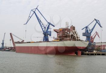 Large Chinese freight ship docked in Huangpu River in Shanghai